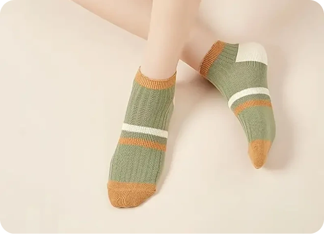 Green and brown striped socks on a light background